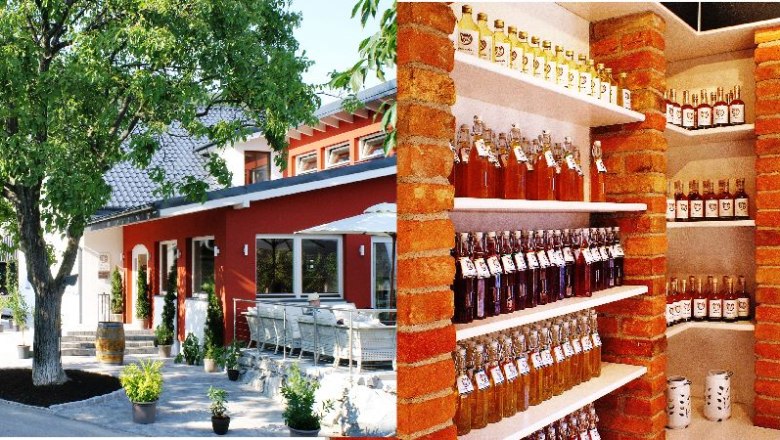 Local Müllner Tom, © Helge Wöll Exterior view of a red building with terrace and tree, next to it a shelf with bottles in an interior room.