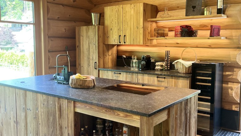 Kitchen, © RaxChalet Rustic wooden kitchen with modern equipment and view to the outside.