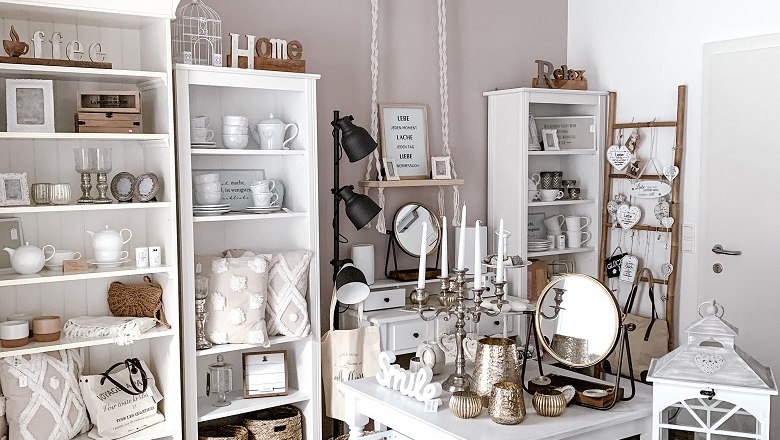 Boutique Mille Fleurs, © Mille Fleurs Interior view of a boutique with white furniture and decorations.