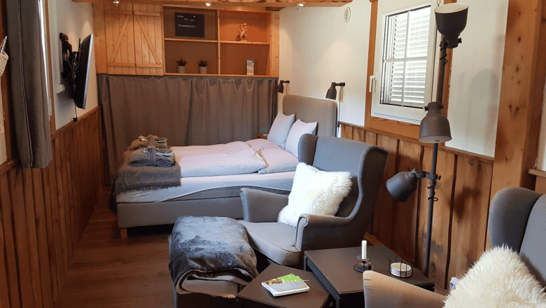 Living and sleeping area in the Tiny House Living Legends, © Edermühle Living and sleeping area in the Tiny House Living Legends, © Edermühle