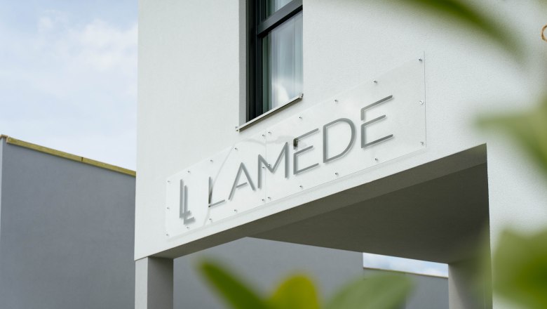 Exterior view, © Hotel Lamede Modern building exterior with the lettering 'LAMEDE' on a sign.