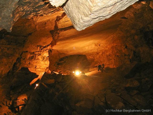 Interior view of the Hochkar cave with illuminated rock formations.