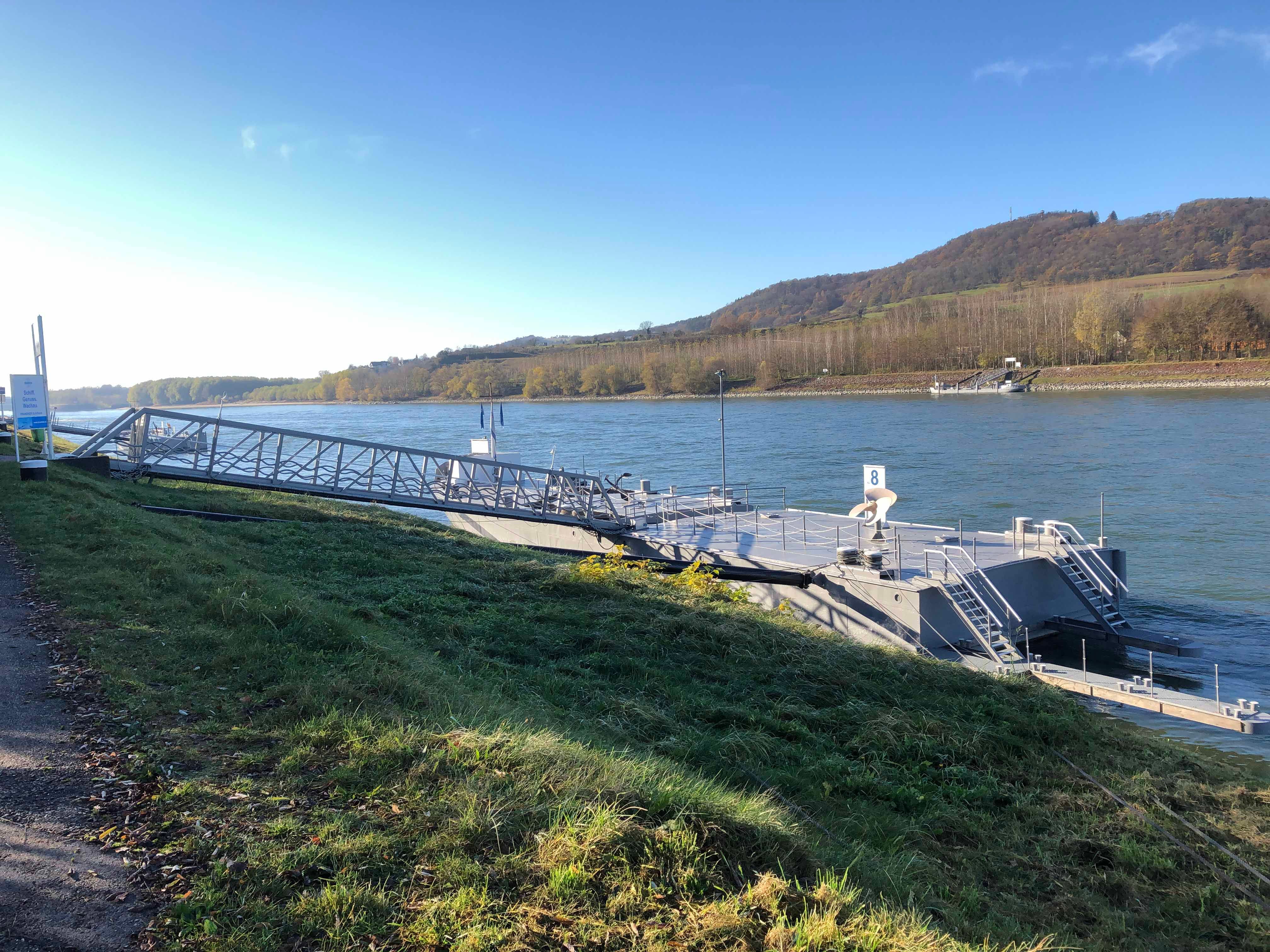 Mooring on a river with hills in the background.