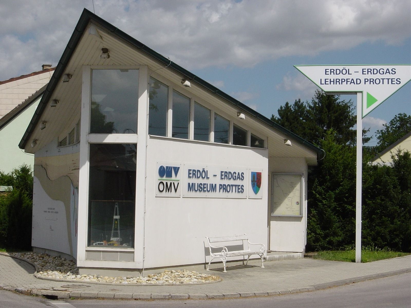 Building of the Prottes Natural Gas Museum with signpost.