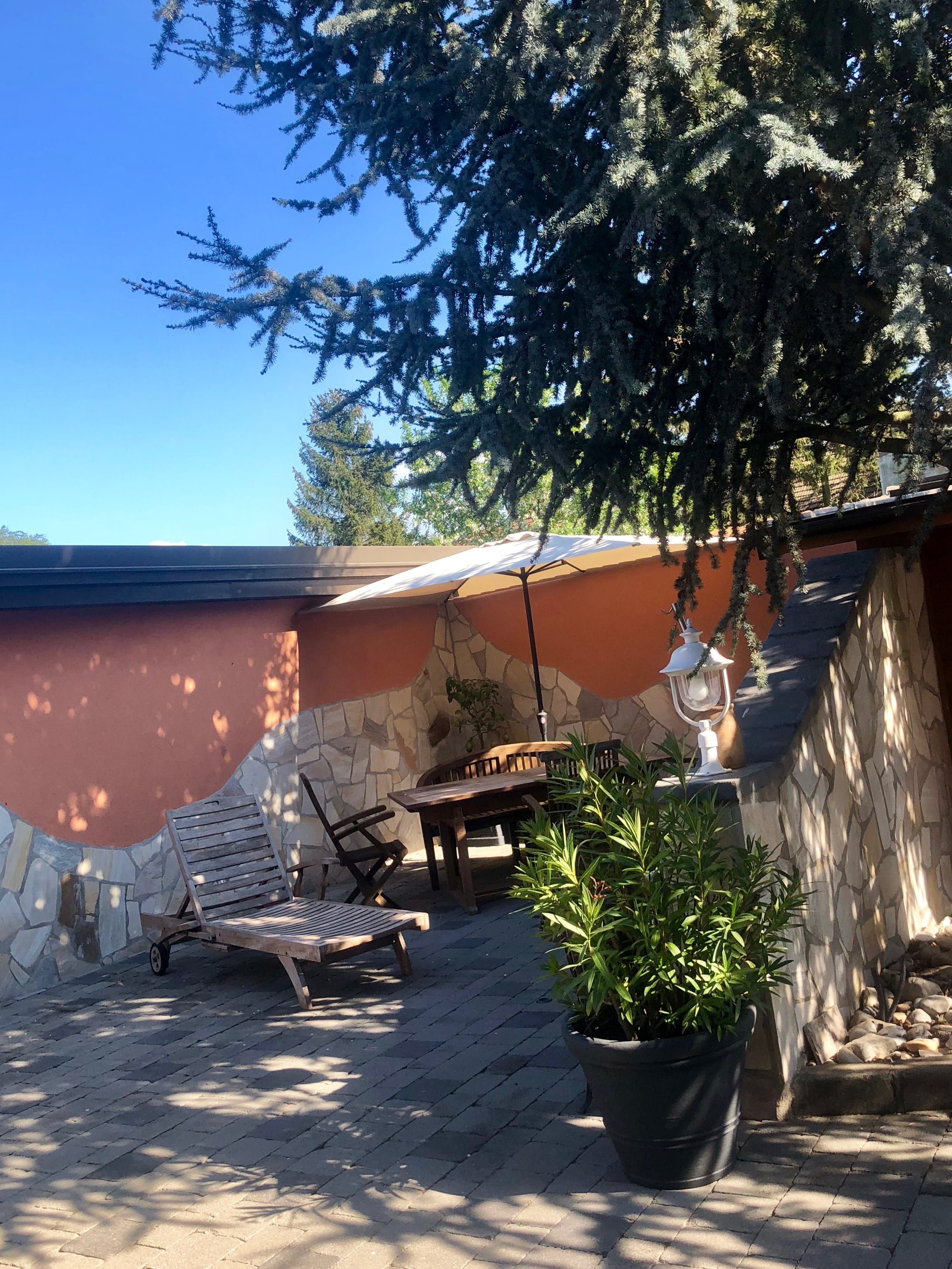 Quiet inner courtyard with plants and seating.