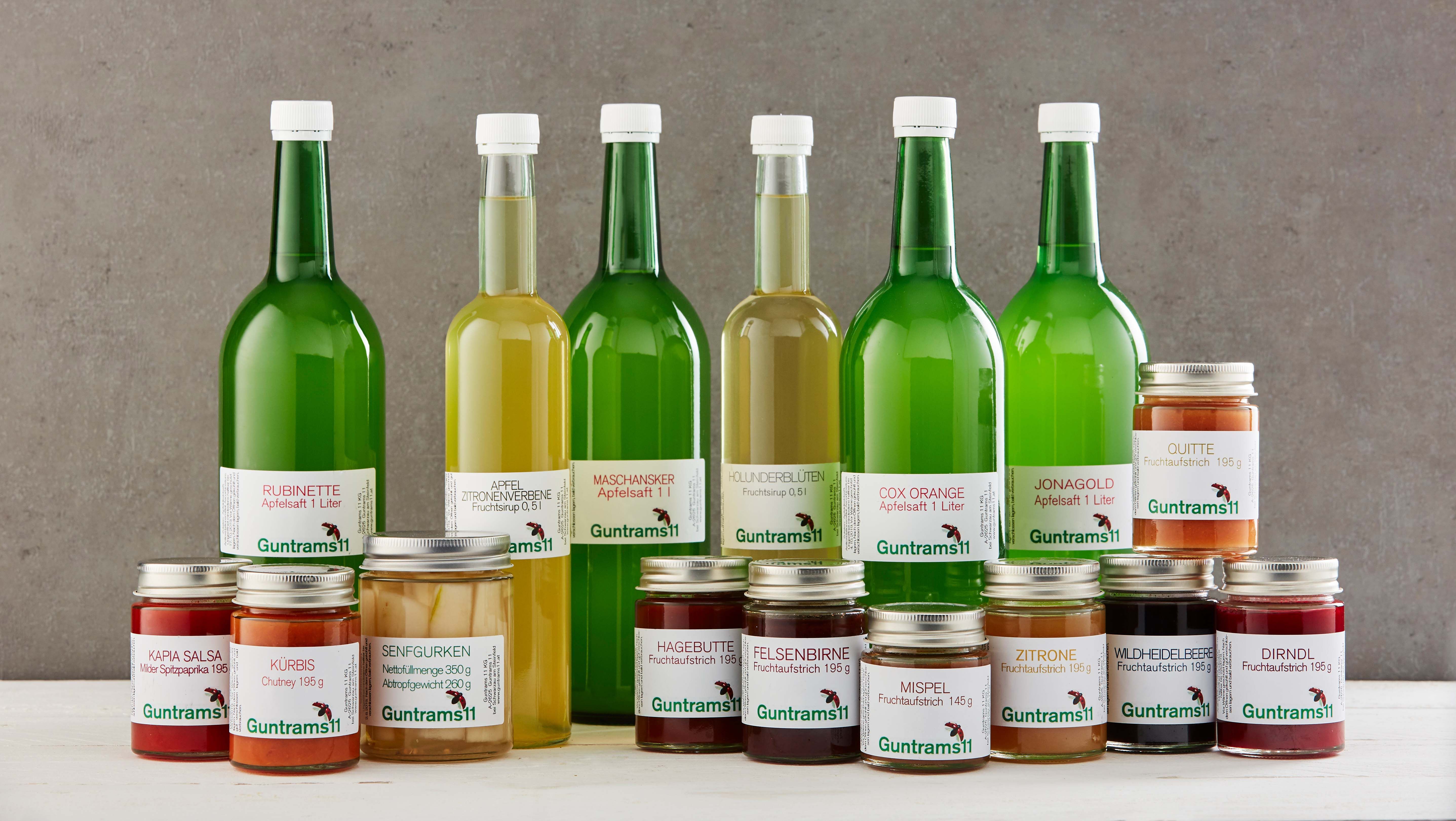 Products from Gut Guntrams: apple juices and fruit spreads in jars and bottles.