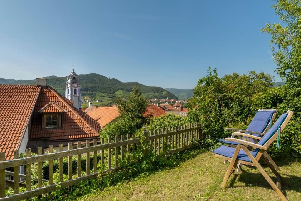 View of Dürnstein with church and deckchairs in the foreground.