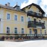 Yellow building with balcony and flower boxes, Land-Pension Kaiserhof.