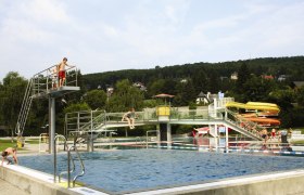 The Wienerwaldbad in Purkersdorf with swimming pool, diving tower and slides.
