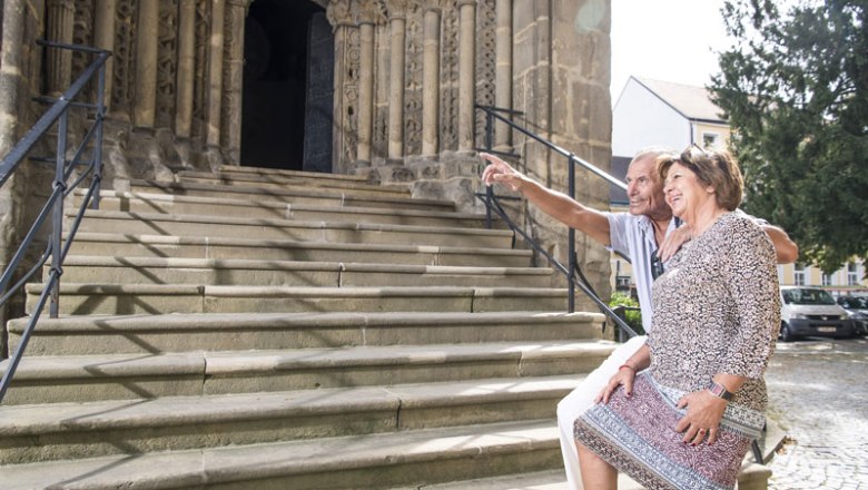 Karner entrance portal with people in front of it