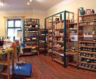 Interior view of a farm store with shelves full of products.