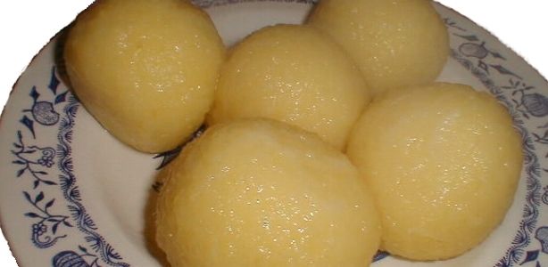 Five potato dumplings on a plate with a blue pattern.