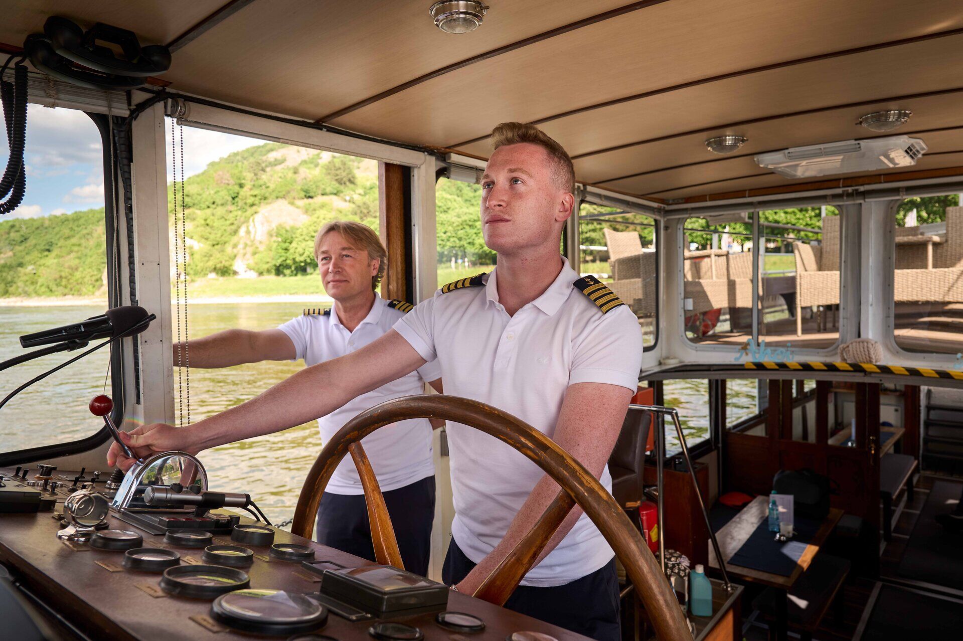 A captain at the helm of a ship.