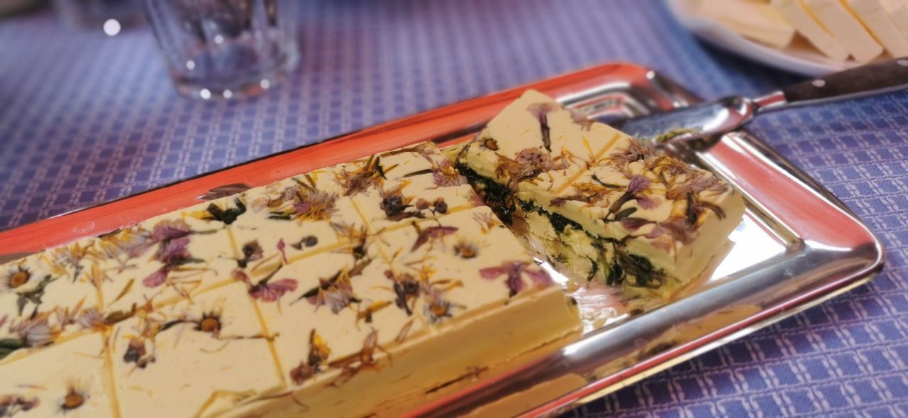 Cake with fruit on a tray at the table