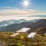Picnic table on a mountain with a view of the sea of clouds and the sun.