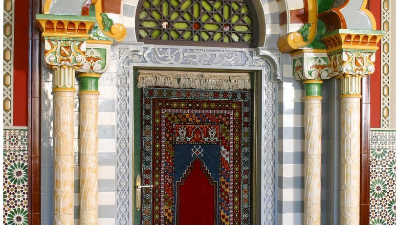 Decorative door with oriental patterns and columns.