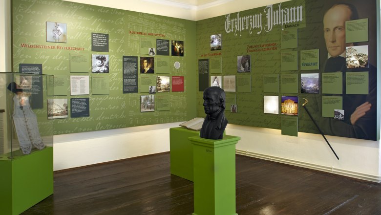 Exhibition room about Archduke Johann with information boards and bust.