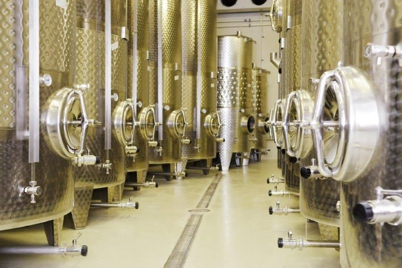 Modern wine barrels side by side.