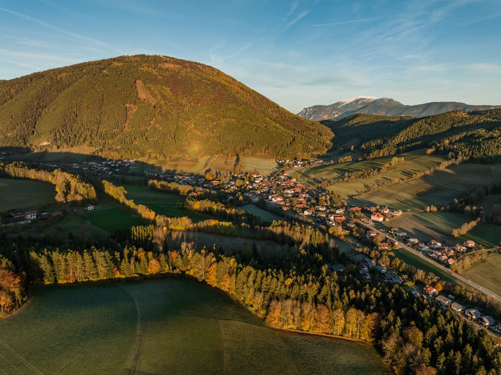Aerial view of Otterthal with surrounding hills and forests.