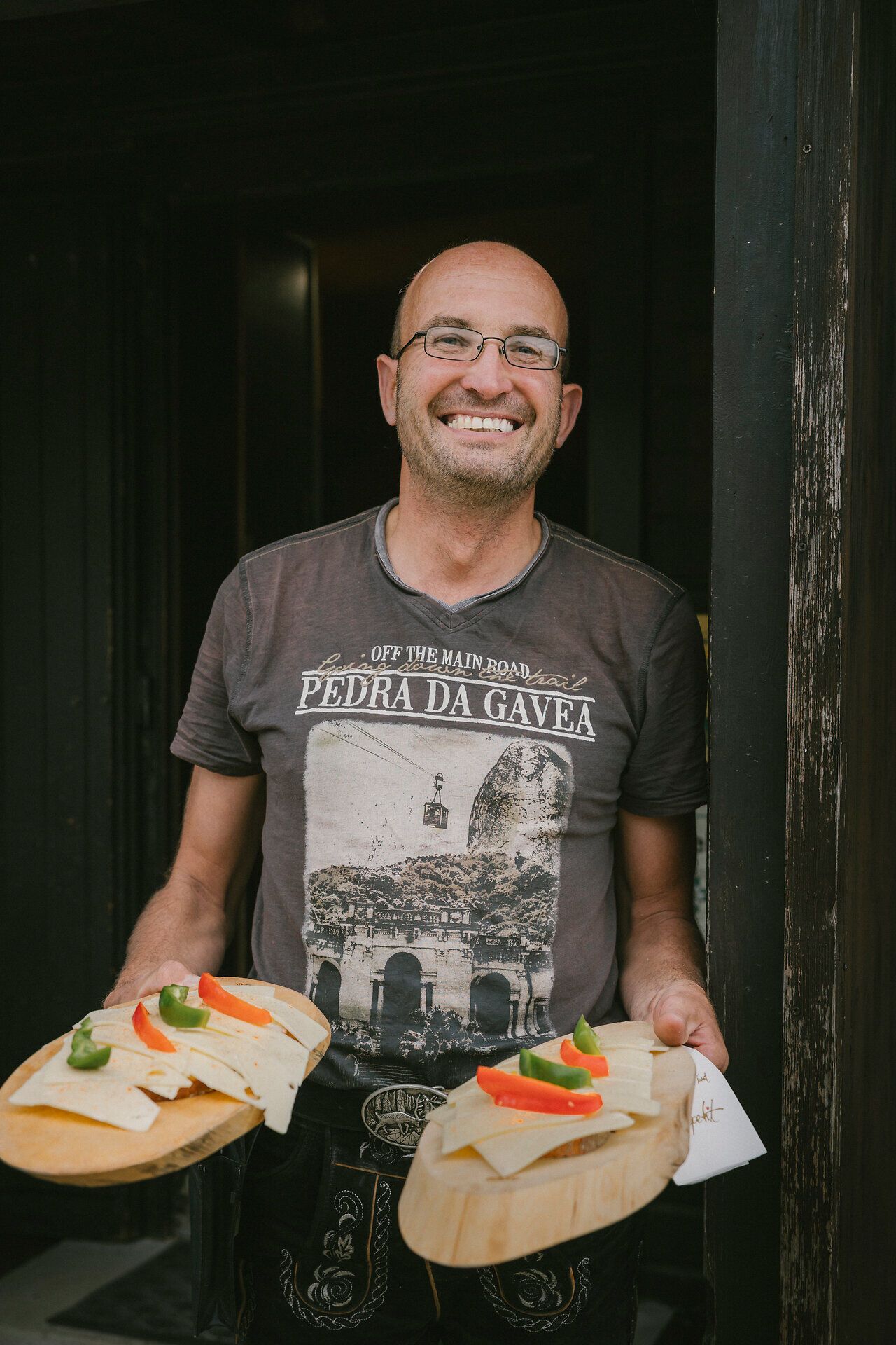 The owner of the Neue Seehütte on the Rax, serving two sandwiches