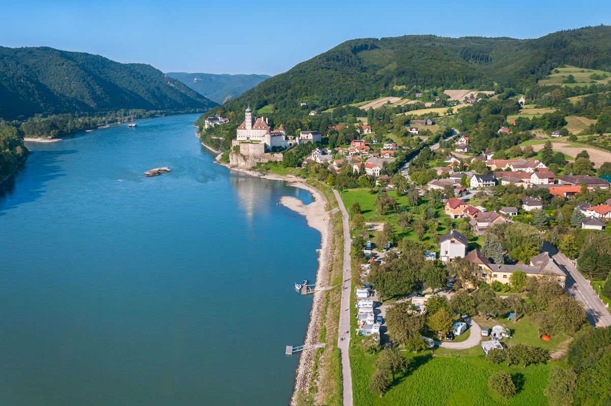 Aerial view of Schönbühel on the Danube with castle and surrounding landscape.