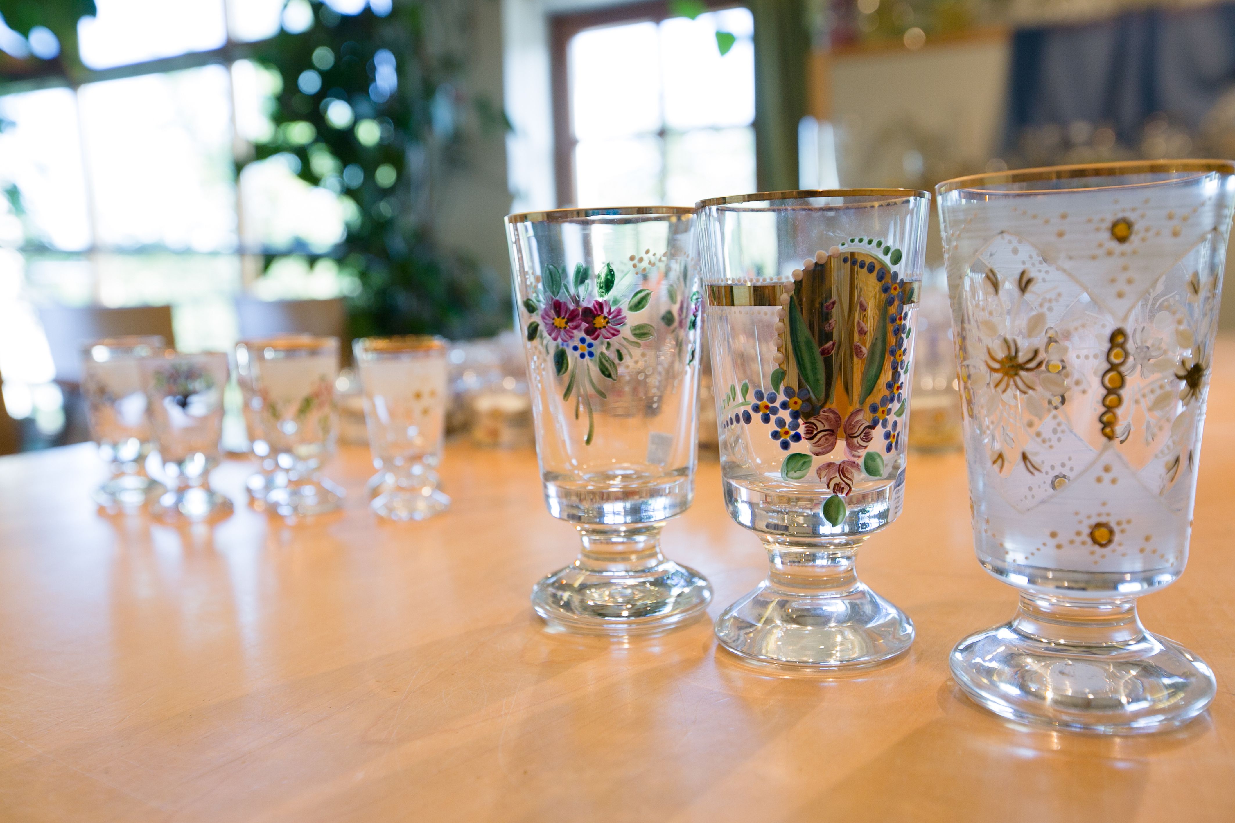 Close-up of artistically painted glasses on a table.