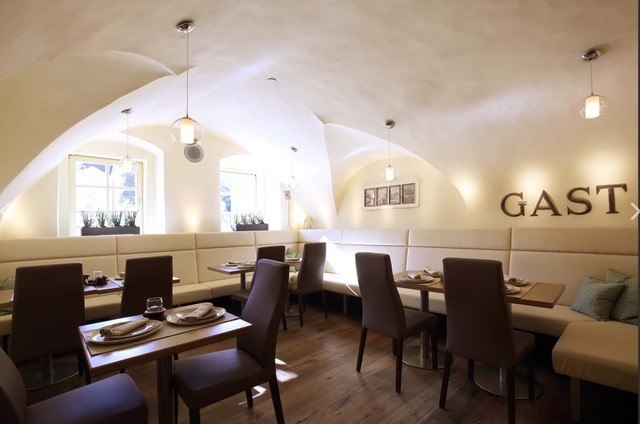 Tables in the restaurant nestled in a vault