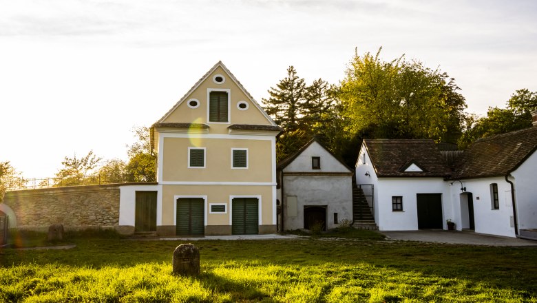 Traditional buildings in the Sitzendorf wine cellar lane at sunset.