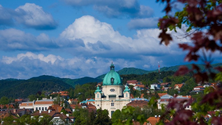 Town view of Berndorf with church and hills in the background.