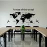 Conference room with a world map on the wall and U-shaped tables.