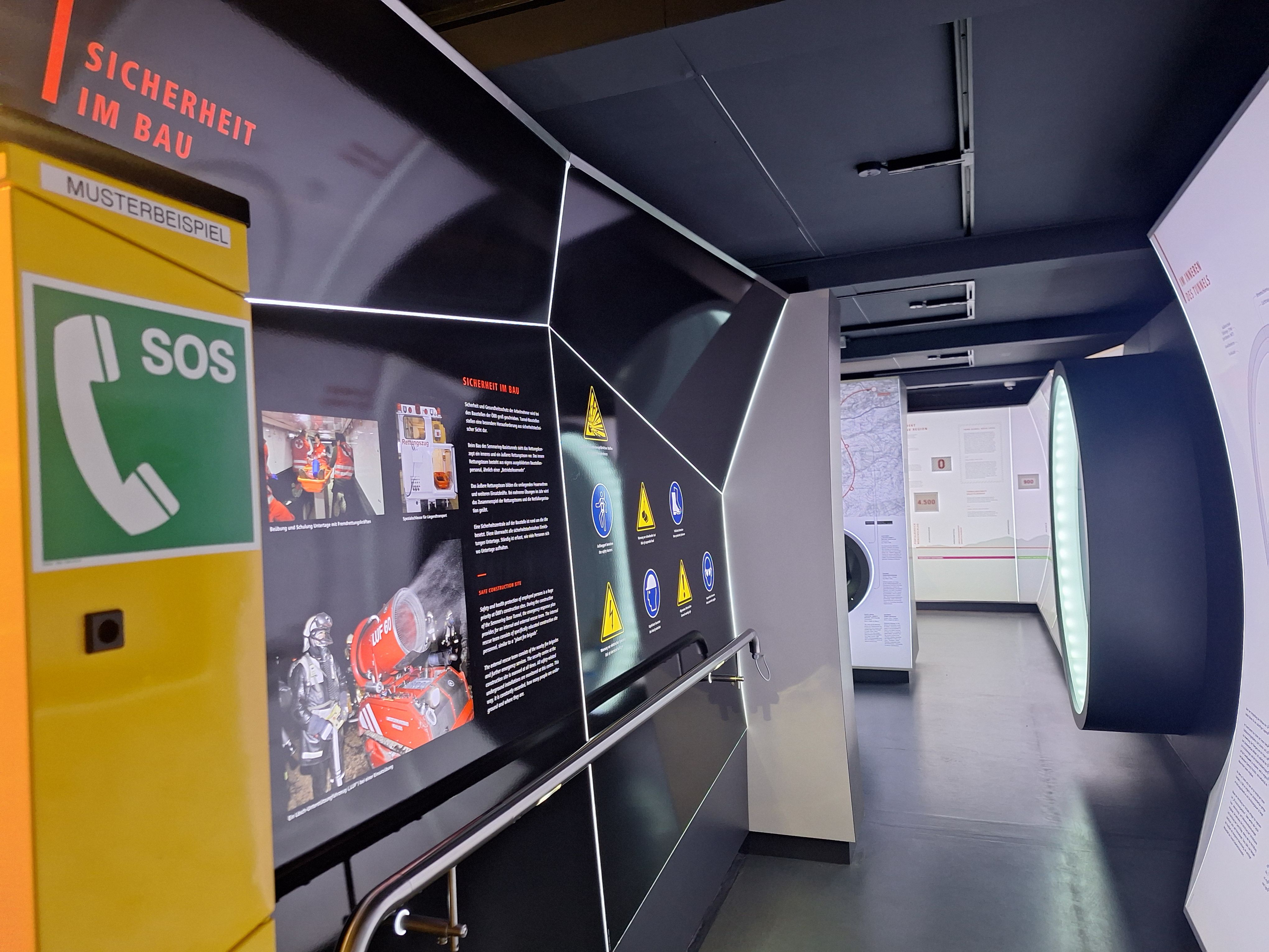 Exhibition on safety in construction with SOS telephone and information boards.