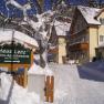 Winter scene with Lenz house and snow-covered path.