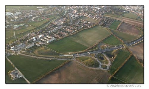 Aerial view of Zwölfaxing with streets, fields and buildings.