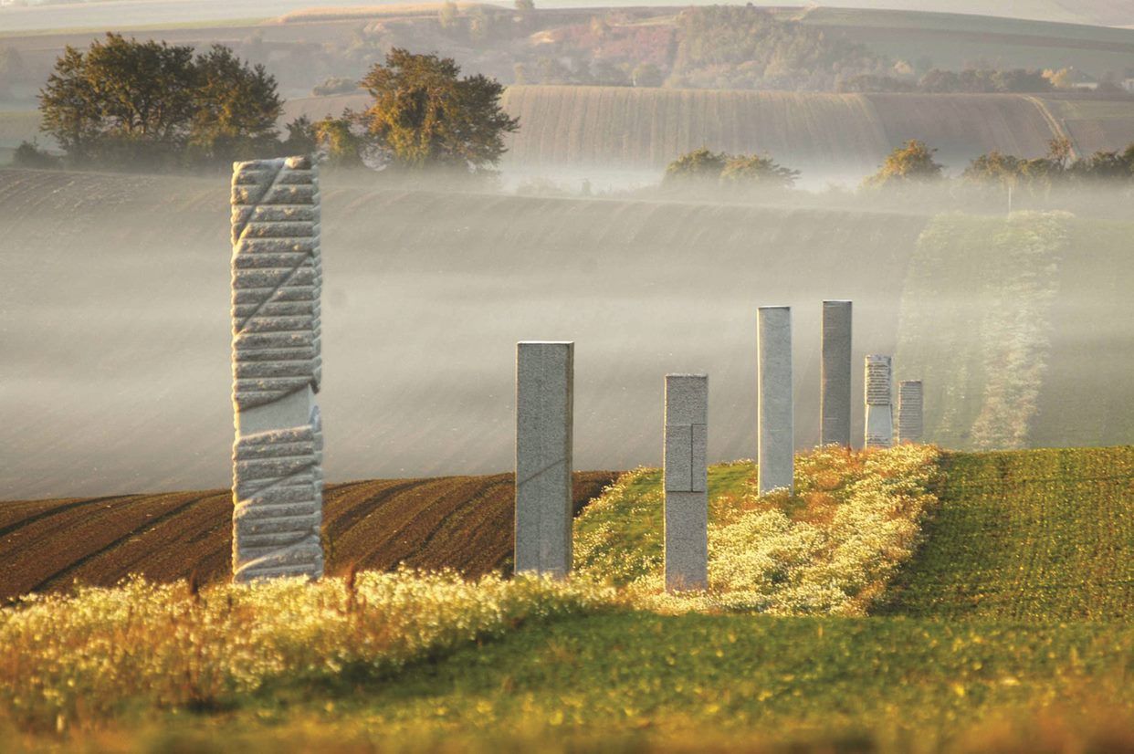 Stone sculptures in a misty landscape near Harmannsdorf.