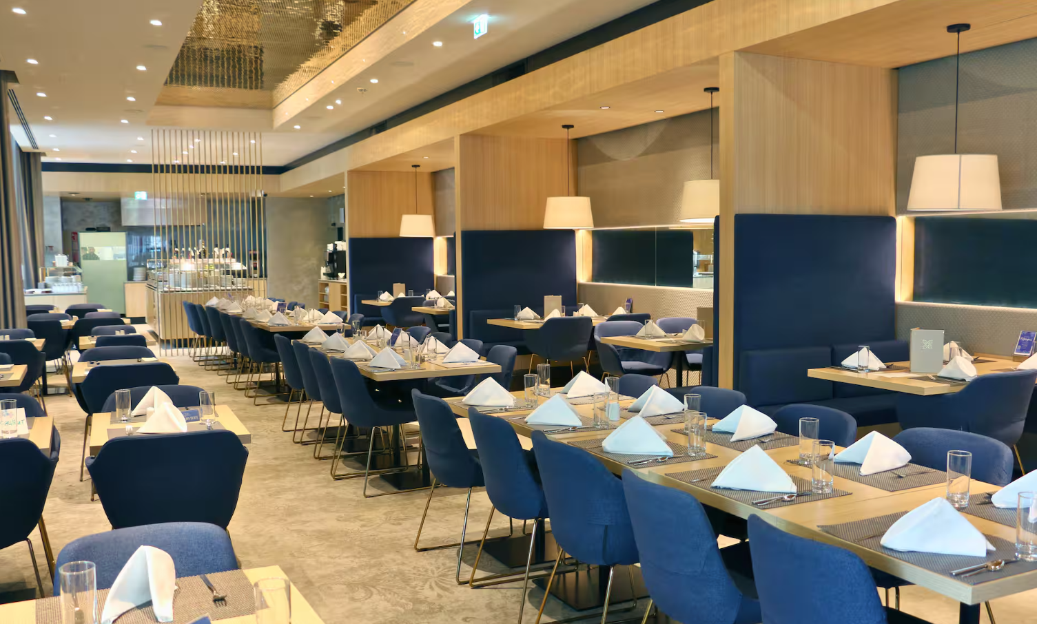 A modern restaurant with blue chairs, interior view