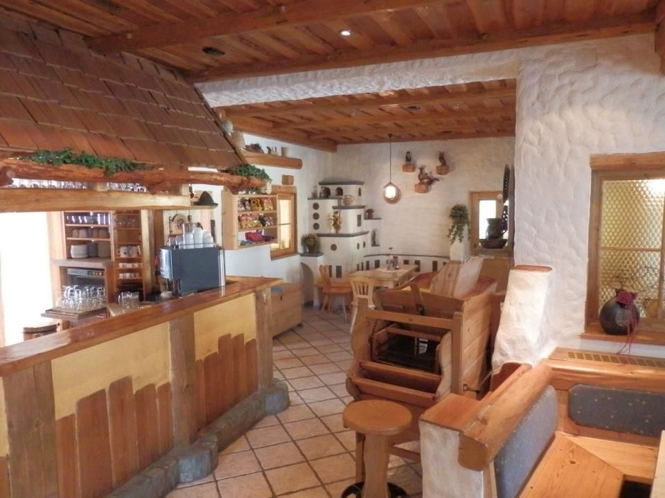 Cozy dining room with wooden furniture and rustic decor.
