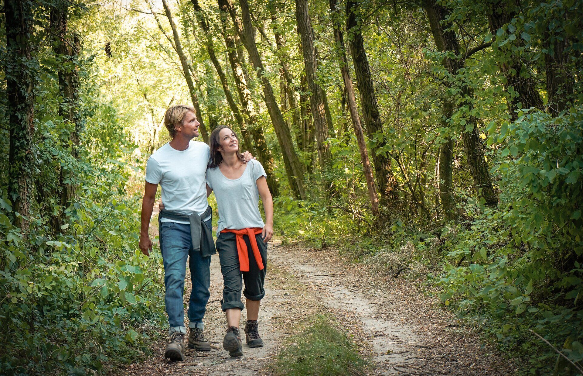 Couple hiking on a forest path