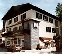 A two-story building with a balcony and terrace, labeled 'Steinbrunner'.