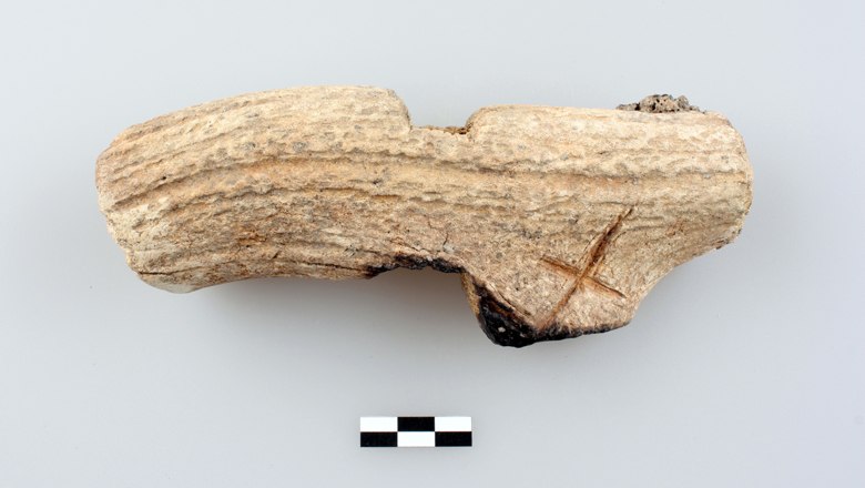 Late Bronze Age hammer made from deer antler with an incised X.