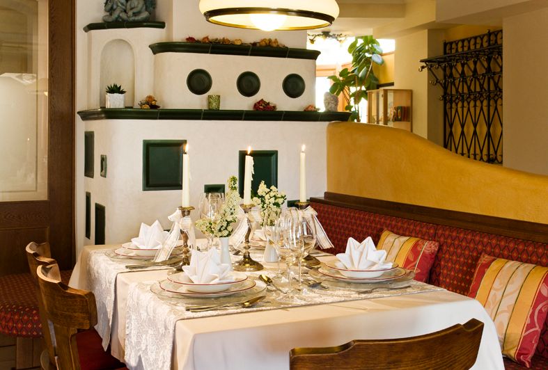 Elegant restaurant with laid table and candles.