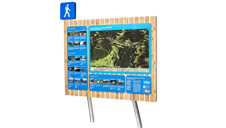 Hiking trail information board with map and information.