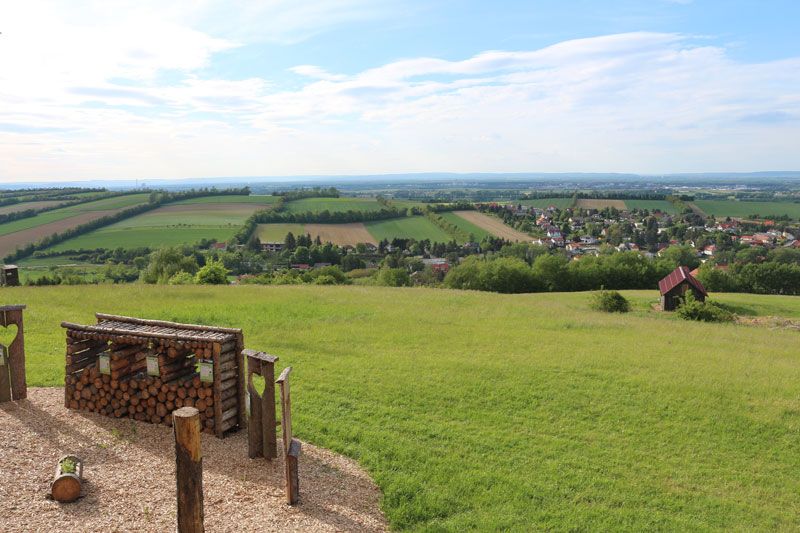 View of green fields and a village from the Tullnerfeld balcony.