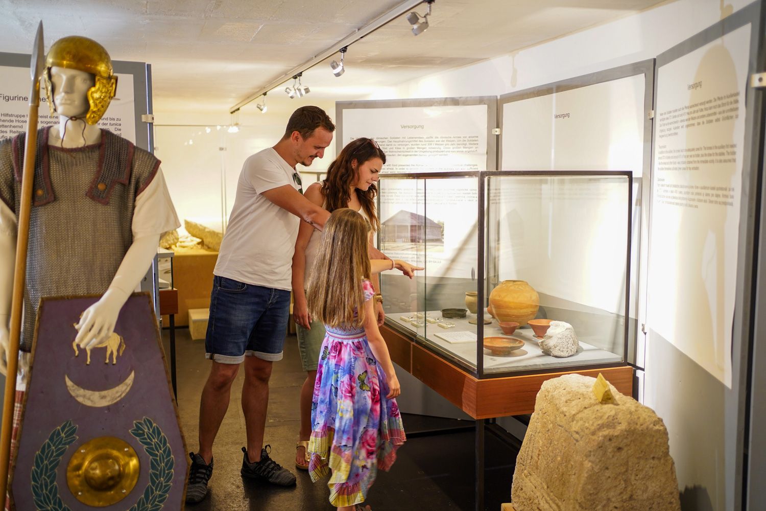 Family looking at exhibits in the museum.