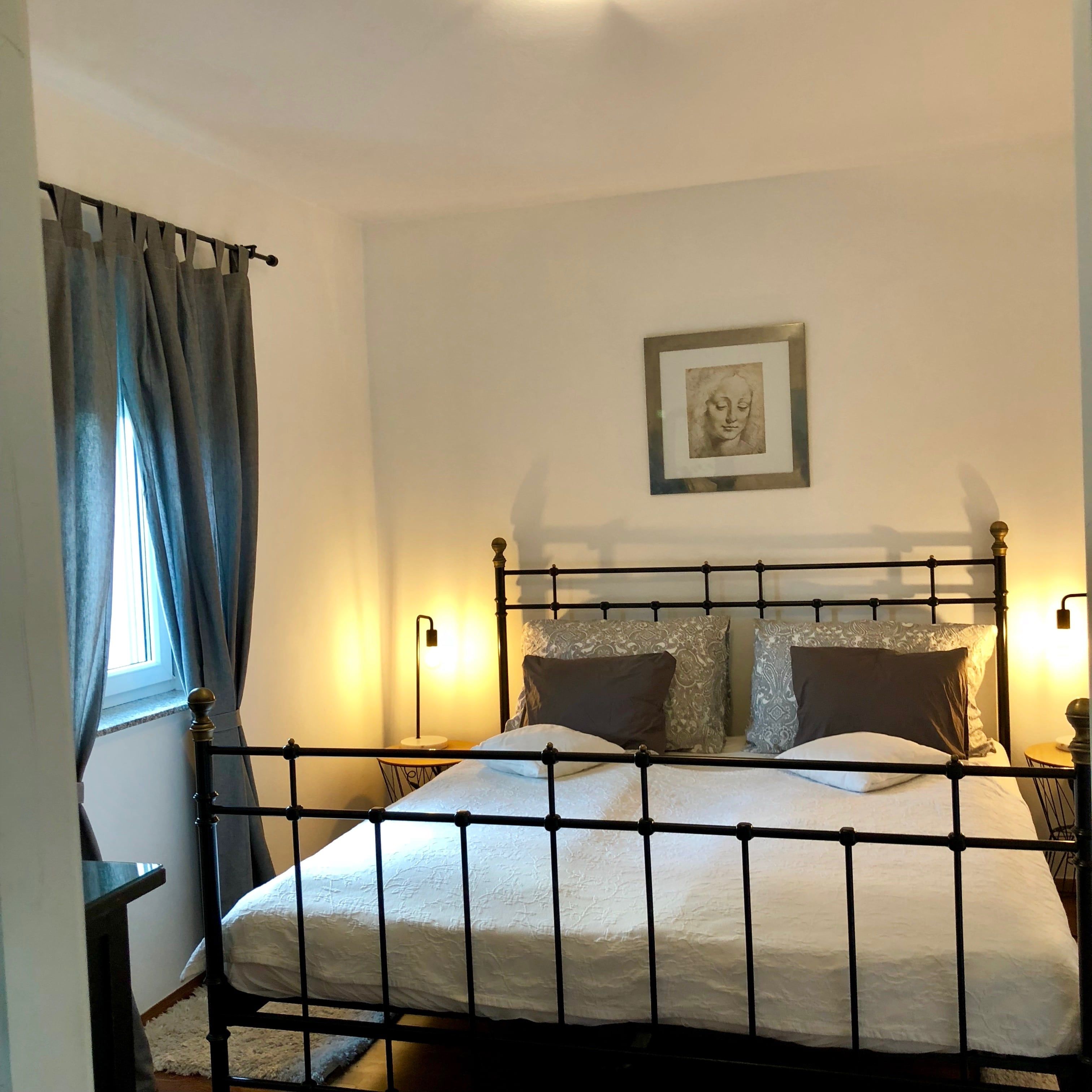 Simply furnished bedroom with bed and quiet atmosphere.