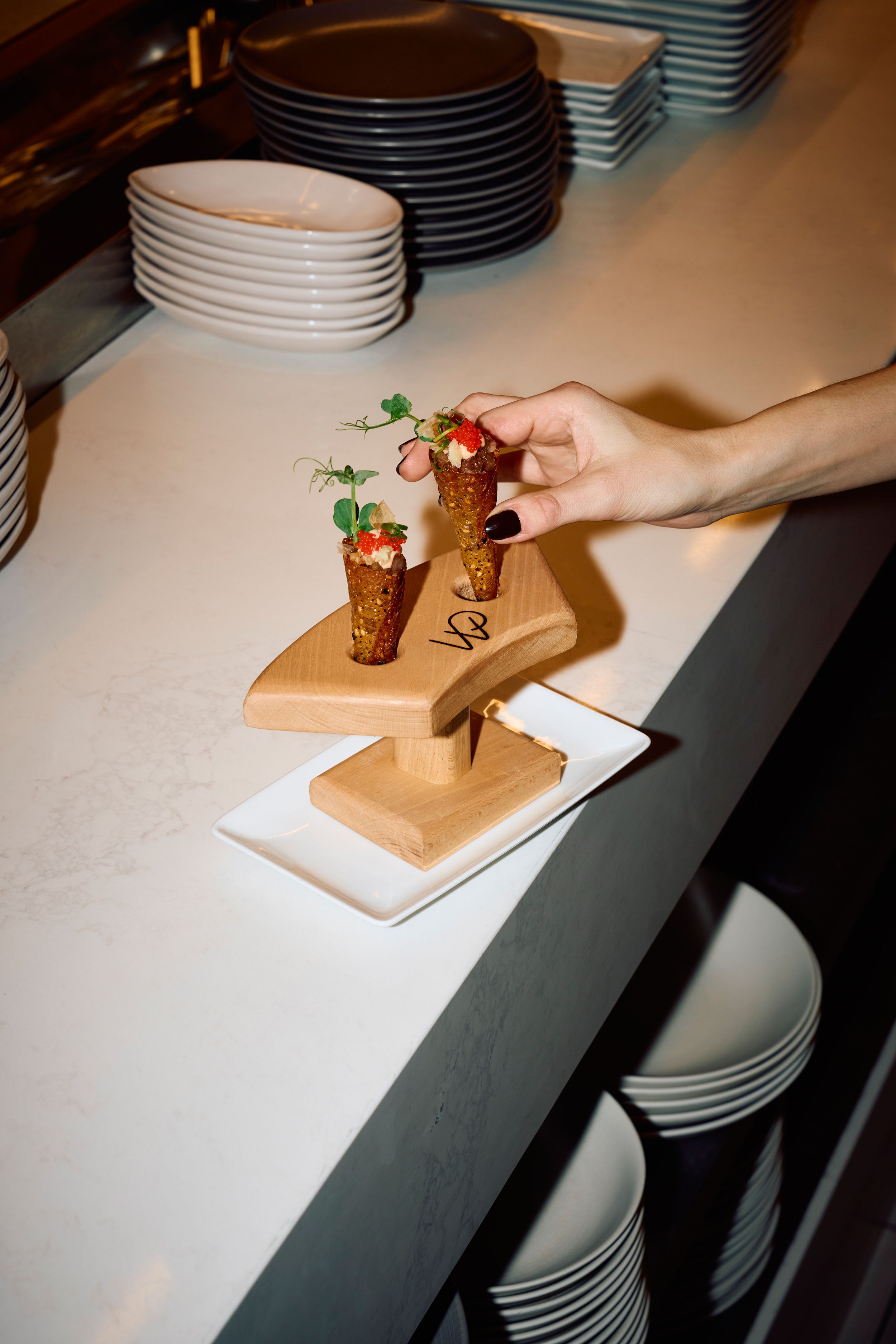 Wolfgang Puck Kitchen + Bar, Small dish in a wooden plate