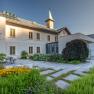 Inner courtyard of a historic building with garden and tower.
