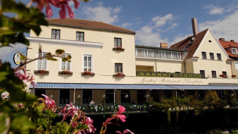 Hotel and Gasthof Klinglhuber with flowers in the foreground.