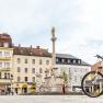Town square with fountain, bicycle in the foreground, Hotel Zentral in the background.