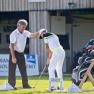 A golf instructor gives instructions to a student on a practice course at the Diamond Golf Academy.