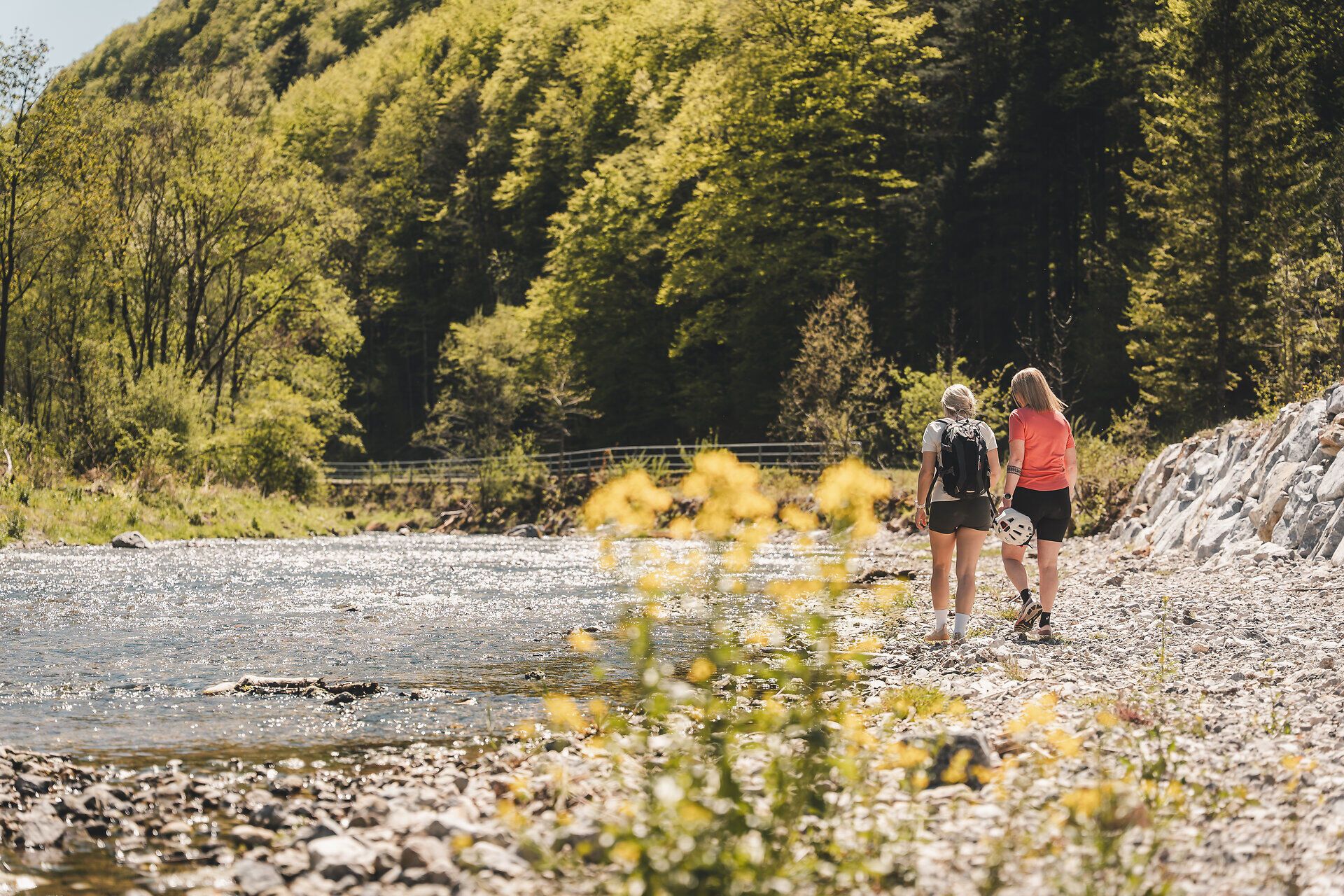 Two women take a break by the water.